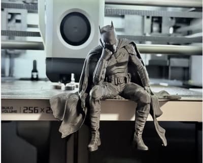 Sad Batman sitting on a Ledge
